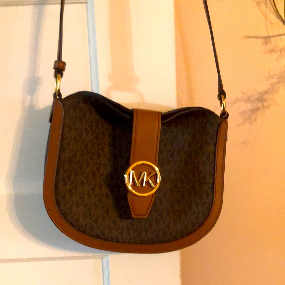 Michael Kors “Gabby” cross body bag.. Small, great for going out.